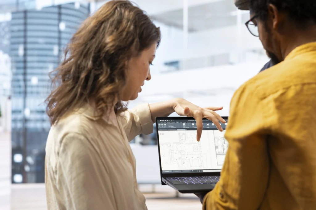 businesswoman explaining her renovation vision laptop