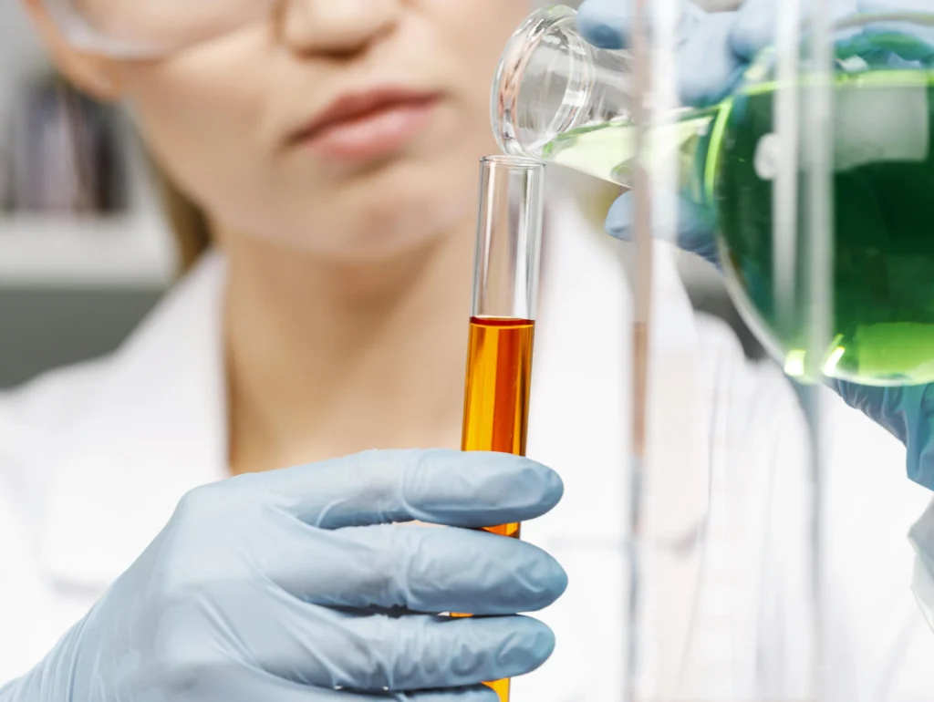 front view female researcher with gloves test tubes