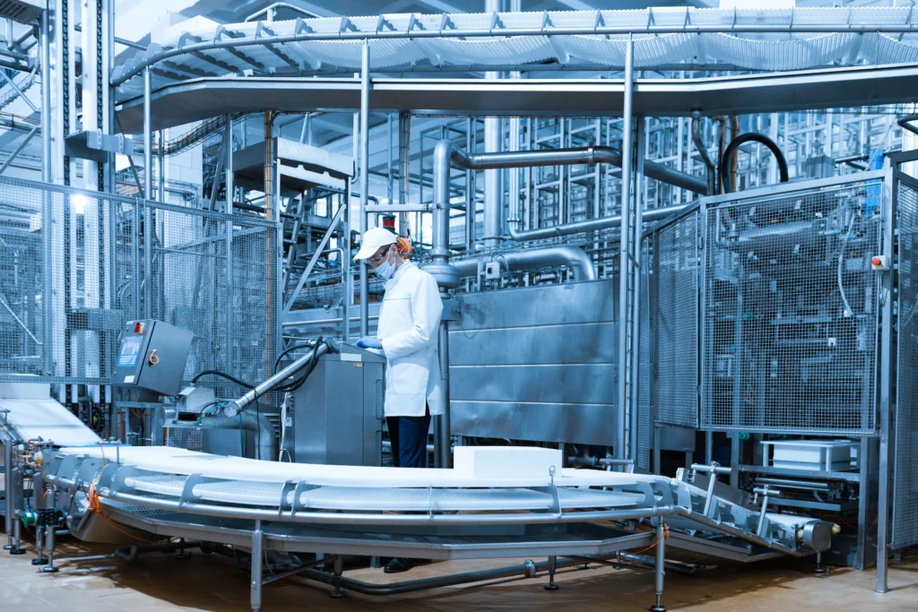 technologist make set up production line while standing near digital screen department dairy factory